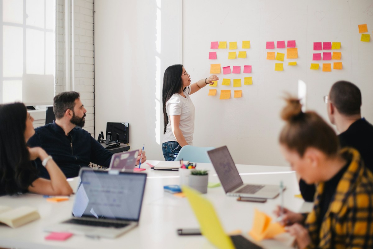 A small team discussing a project around a table